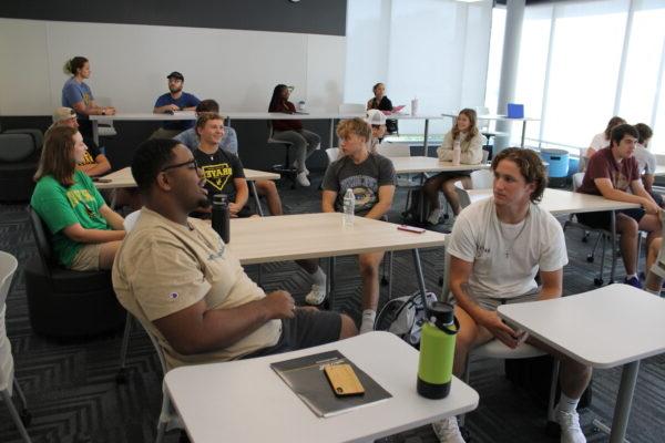 A group of people sitting at tables